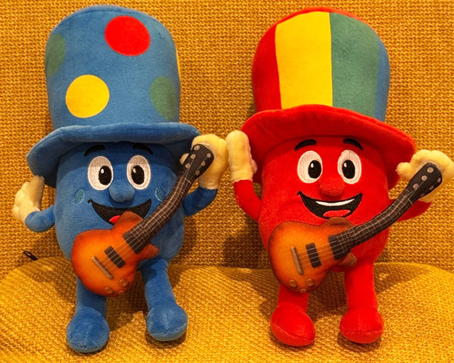Blue and red Happy Hatter character plushies with guitars